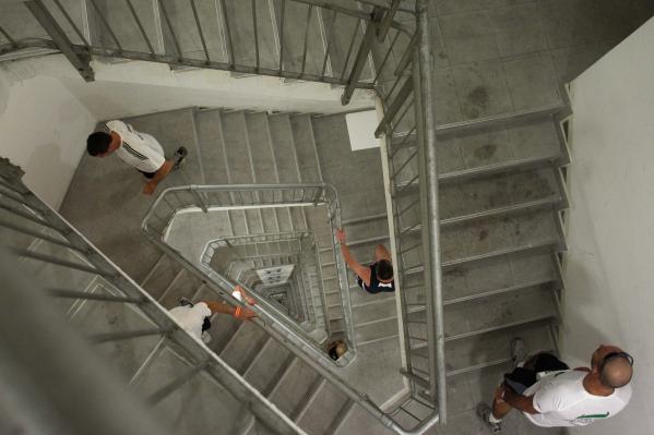 Run up the stairs to the top of the Azrieli Tower